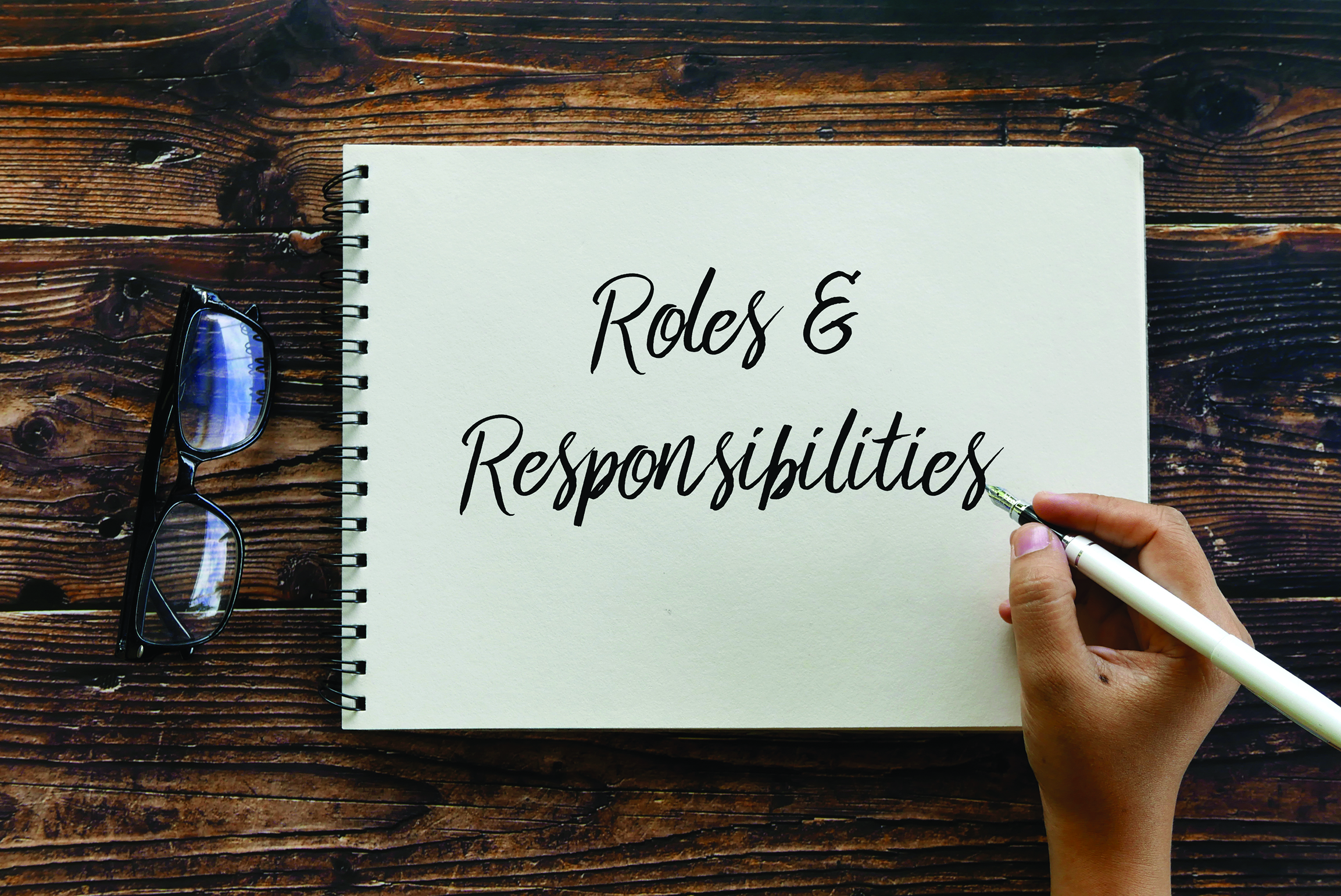 Notepad with the words' 'Roles and Responsibilities'